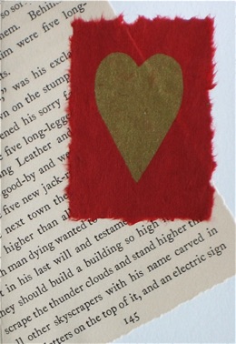 Love Story
red lokta with gold heart on vintage storybook page