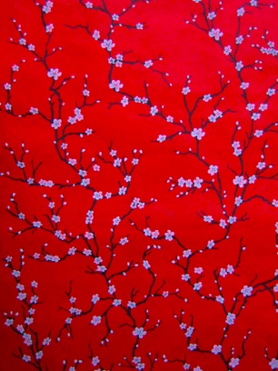 
White Plum blossoms on red